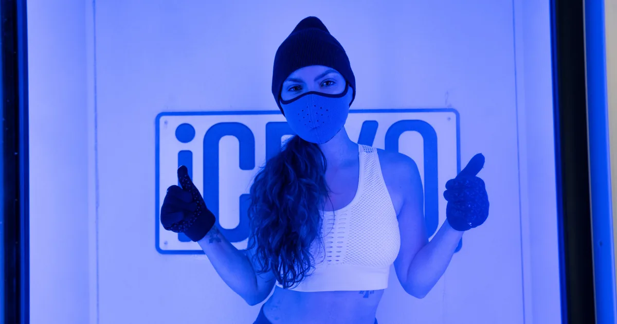 Energized client after a whole-body cryotherapy session at iCRYO Highland Village