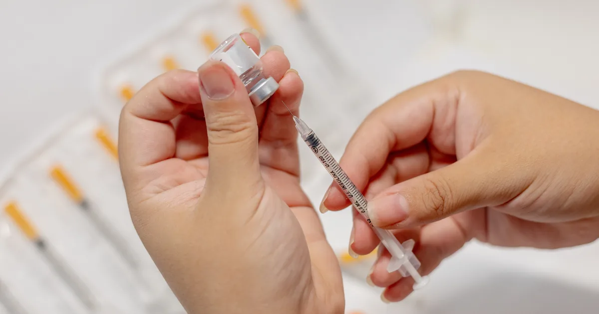 Provider reviewing a physician-supervised peptide protocol with a client at iCRYO Highland Village