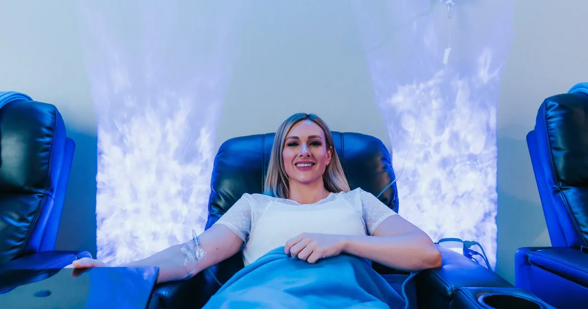 Client receiving IV hydration therapy for energy at iCRYO Highland Village