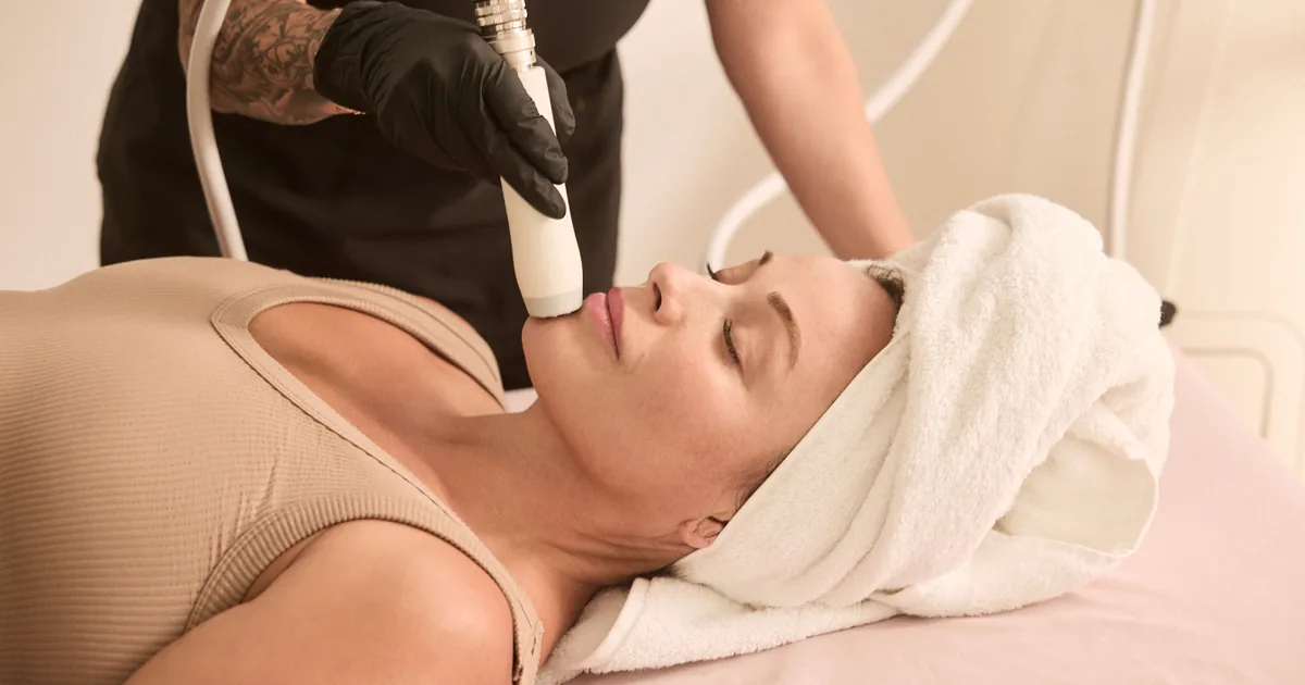 Client receiving T-Shape 2 skin tightening treatment on the abdomen at iCRYO Highland Village