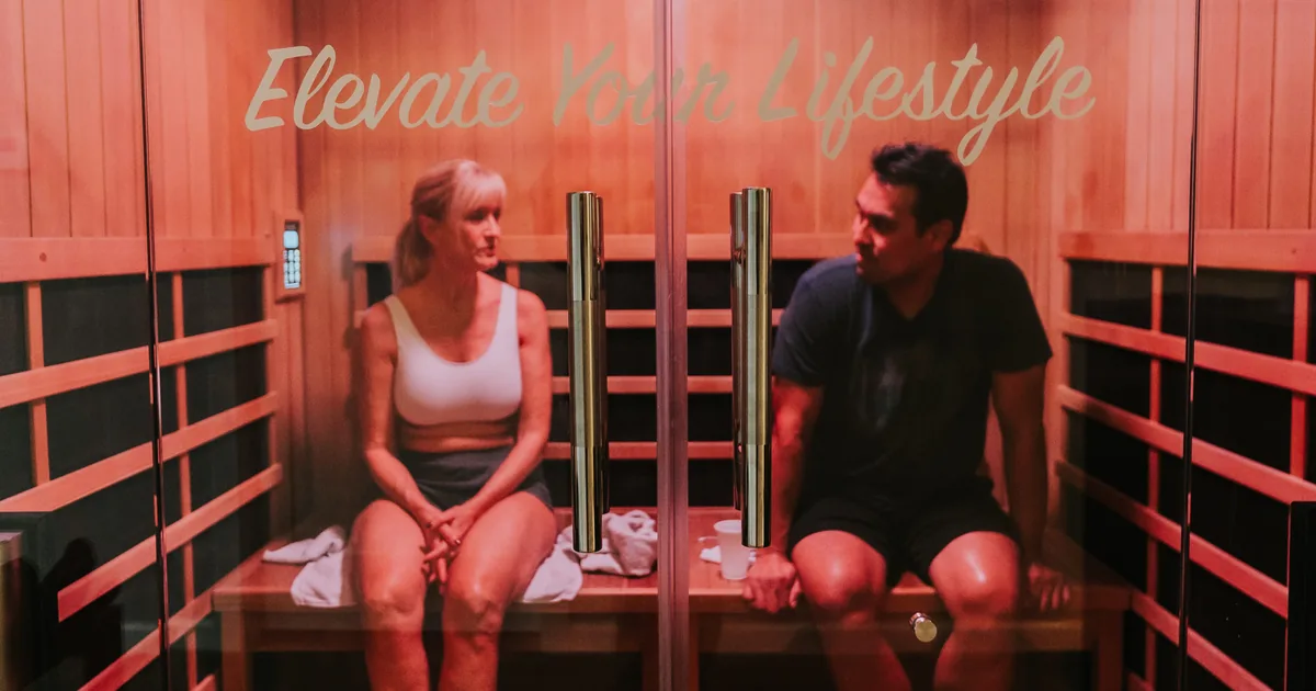 Woman relaxing in an infrared sauna at iCRYO Highland Village, TX