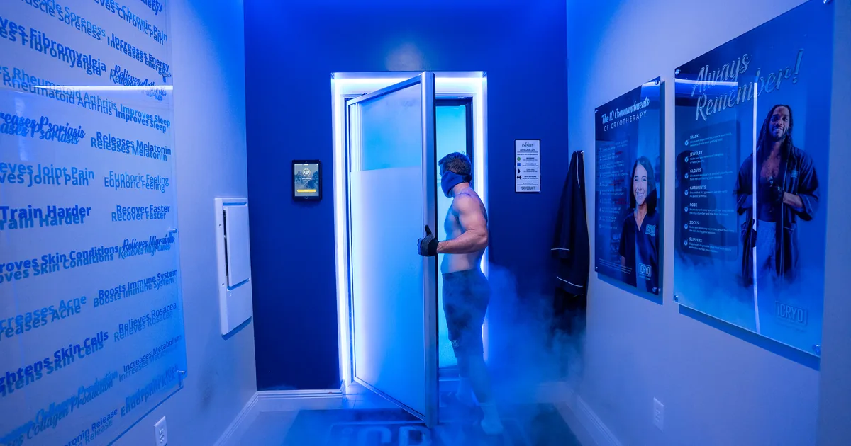 Client in a whole-body cryotherapy chamber with cold vapor at iCRYO Highland Village, TX
